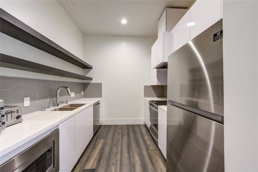 UPGRADED SPICE KITCHEN WITH CUSTOM MILLWORK