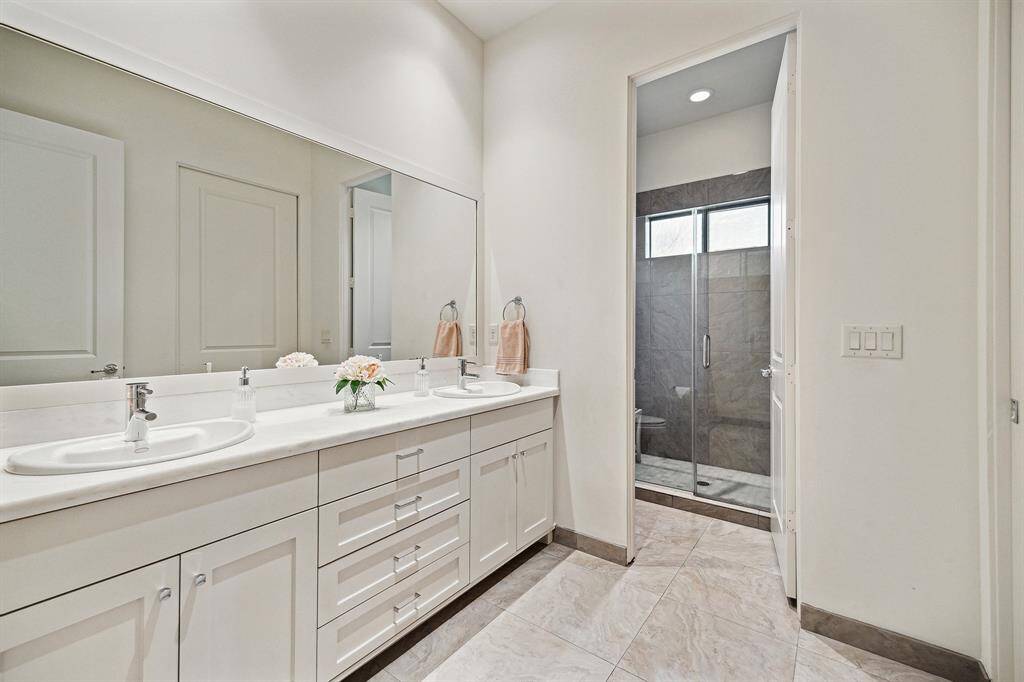 one of three downstairs full on-suite baths