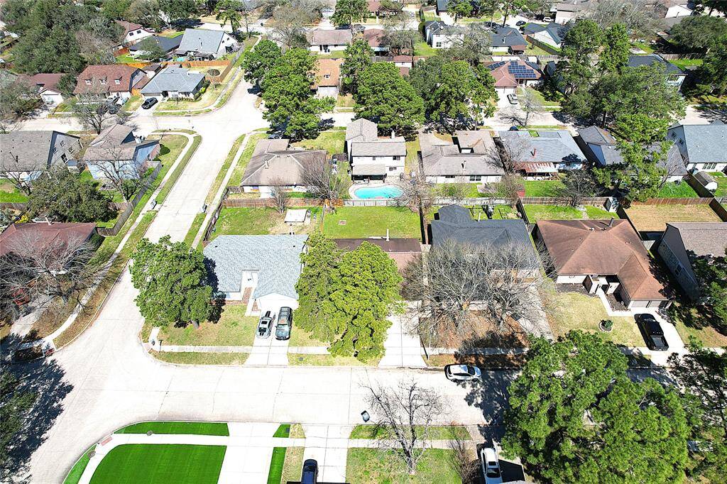 Aerial View of the neighborhood - subject is 2nd from corner.  The mature trees help keep the home cool.