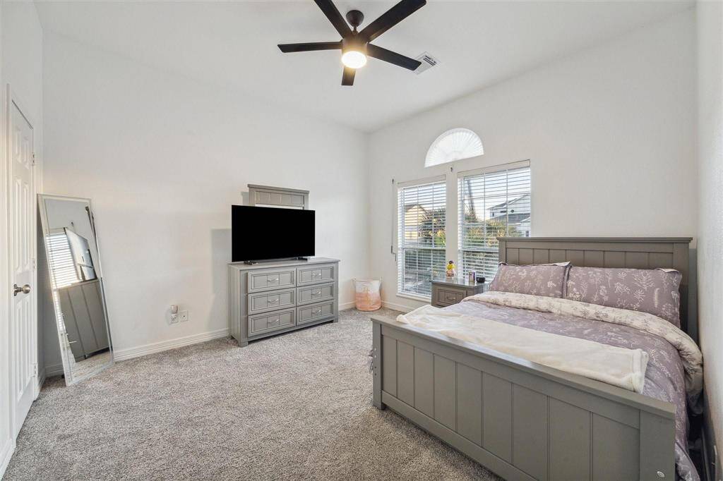 Spacious and inviting guest bedroom.