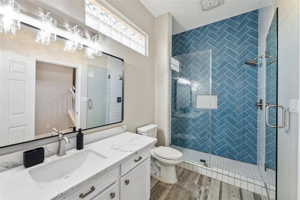 Step into luxury with this spacious, updated walk-in shower, designed to offer a spa-like experience in the comfort of your home.