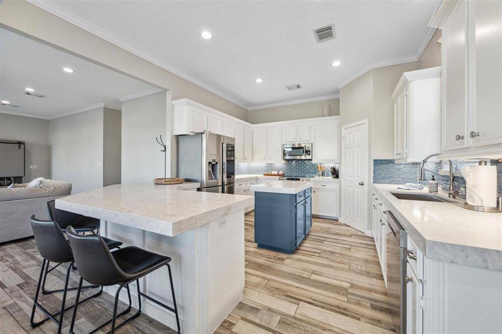 Sleek updated quartz countertops throughout the home.
