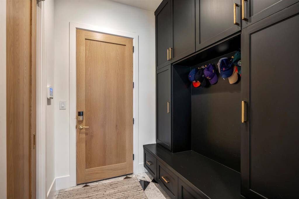 Mud room storage to the right as you walk in from the garage. Large walk-in pantry to the left with a pocket door.