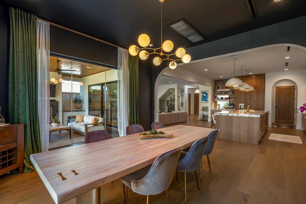 This dramatic formal dining is the perfect stage for unforgettable dinner parties under a designer chandelier.