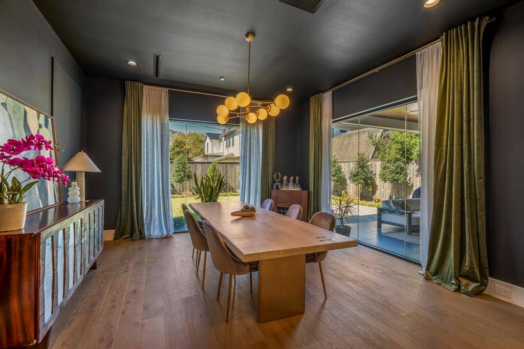 All designer window treatments and curtain rods remain with the home, enhancing its dramatic elegance and luxurious ambiance.