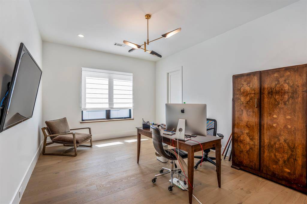The fourth en-suite bedroom in this home is currently used as an office. Window faces south.