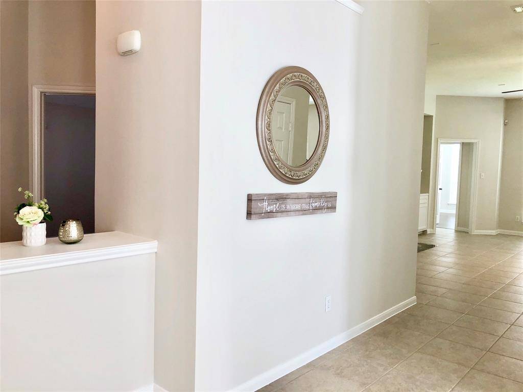 This is an open floor plan with tile and wood looking floors. No carpet!