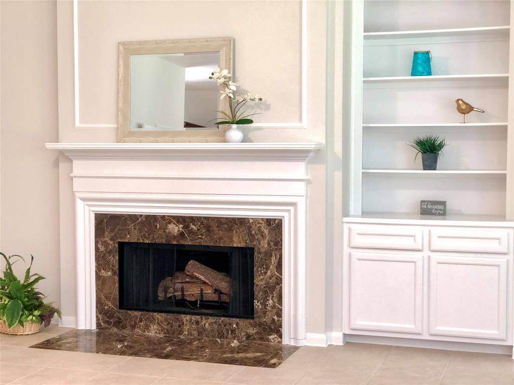 The built ins and fire place adds a nice accent to this beautiful home.