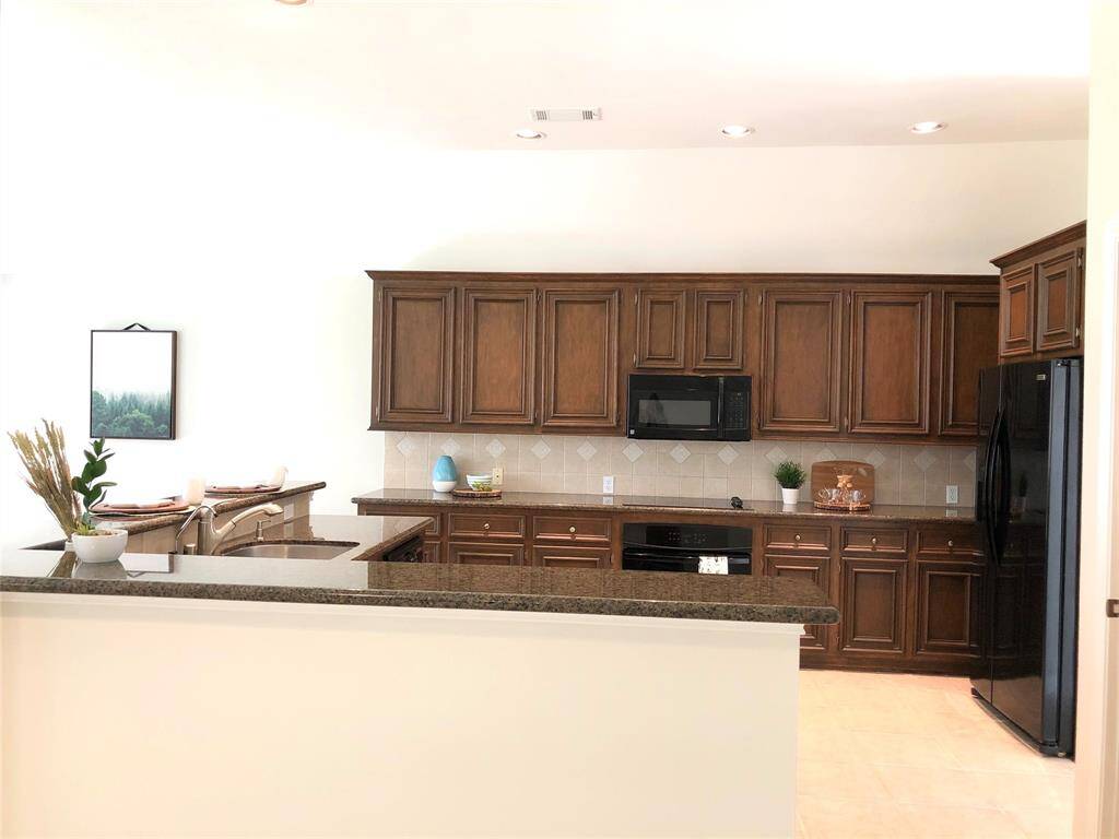 Plenty of cabinets in this open kitchen concept.