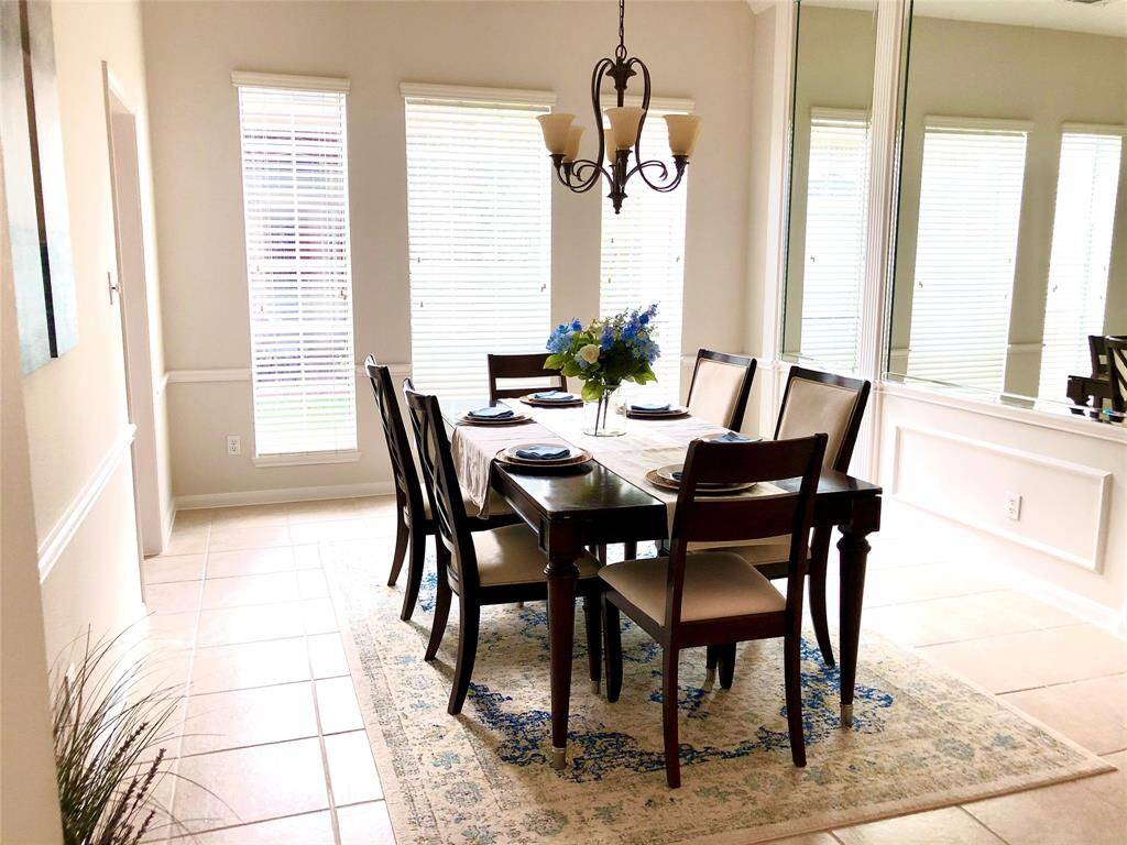 An elegant dining area with plenty of natural light. - Previous Photos for marketing purposes.