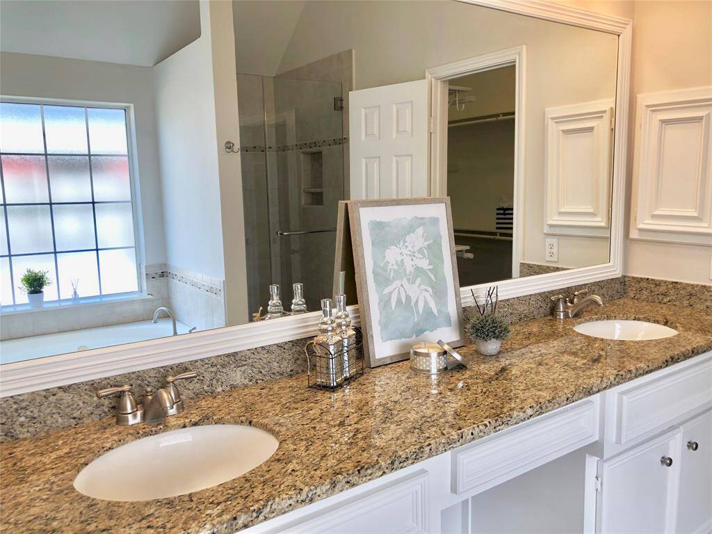 A frameless shower with separate tub.