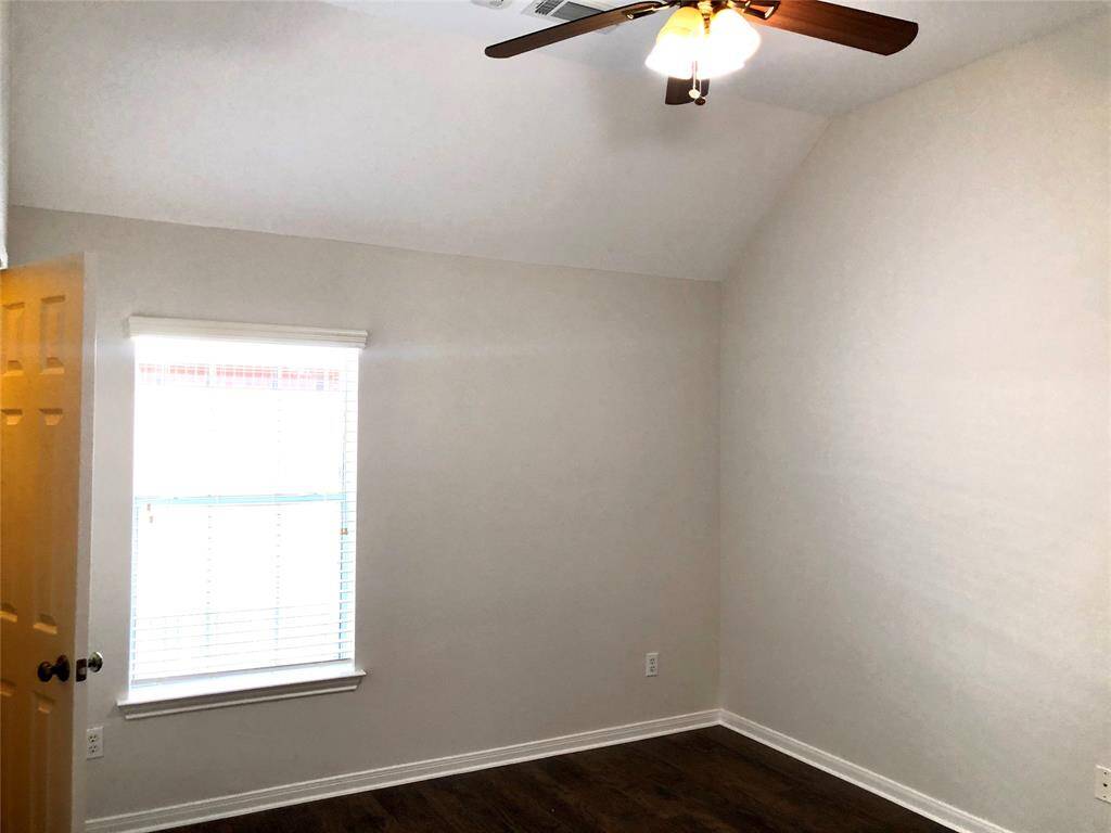 Secondary bedrooms with wood looking floors and fan. (Bedroom 2)