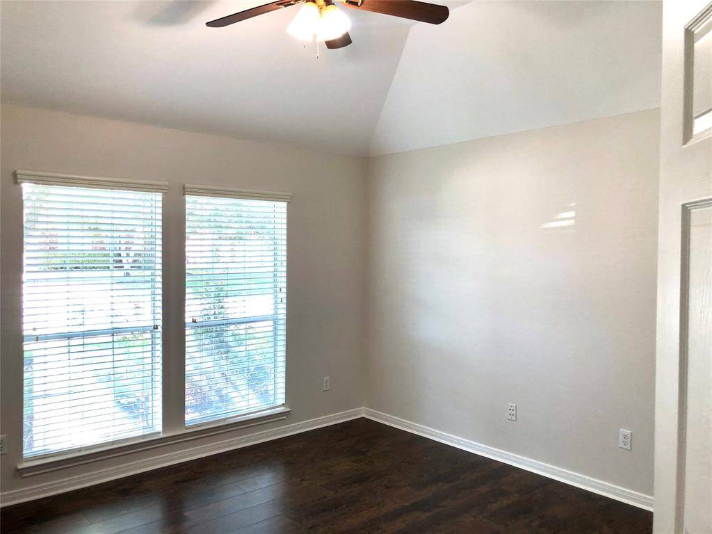 Secondary bedrooms with wood looking floors and fan. (Bedroom 3)