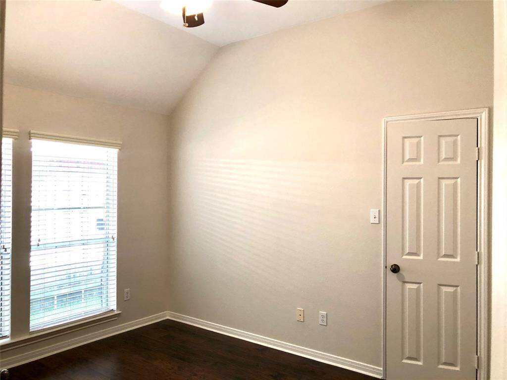 Secondary bedrooms with wood looking floors and fan. (Bedroom 4)