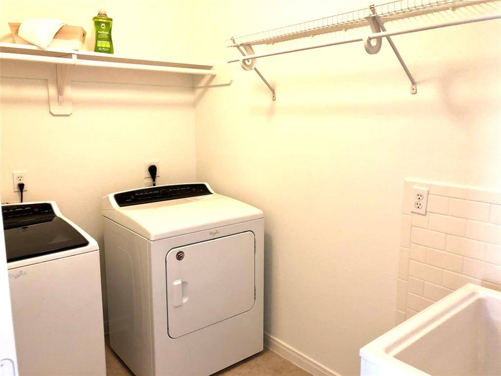 Laundry room with convenient sink, washer and dryer included!!