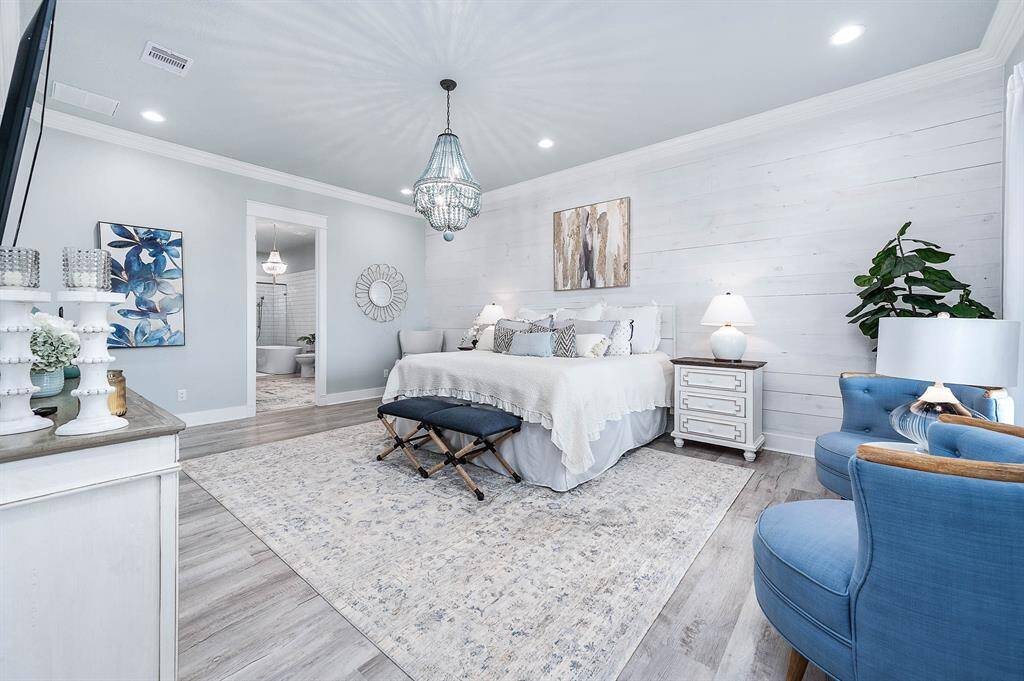 Luxurious primary bedroom with perfect coastal decor.