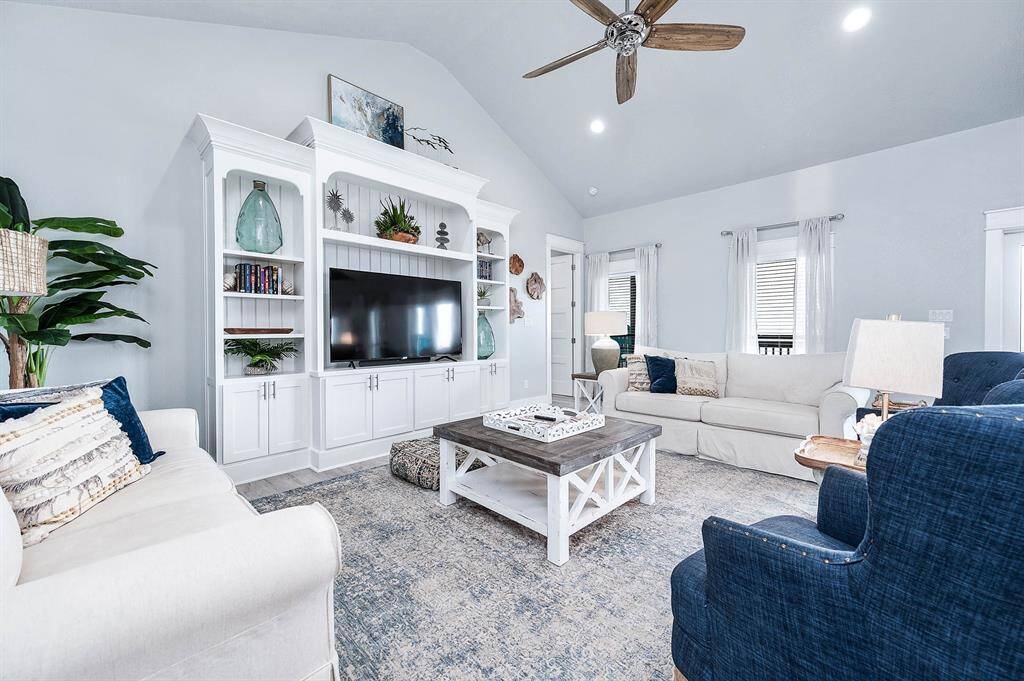 Living room with plenty of seating by the TV.