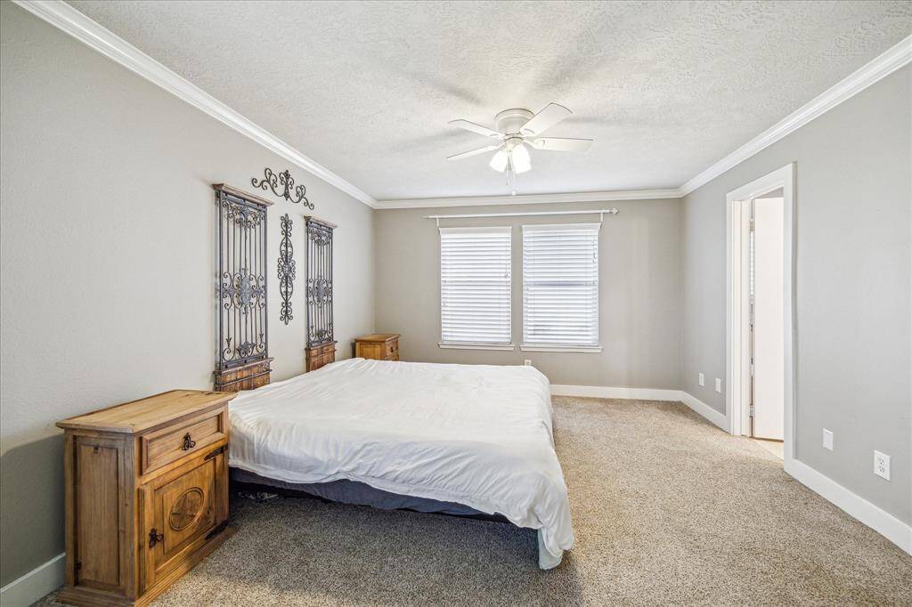 The primary bedroom offers a peaceful and expansive space, ideal for creating your own retreat. With ample room for a large bed, this suite provides the perfect environment for rest and rejuvenation.
