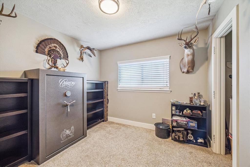 With plenty of space and closet storage, this functional secondary bedroom is ready to serve a variety of needs, from a guest room to a dedicated workspace. The versatility of this room makes it a true asset to the home.