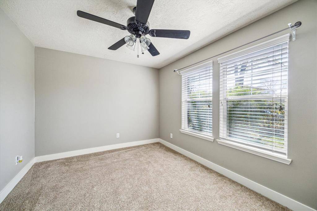 With plush carpeting underfoot, this home office provides a welcoming and comfortable environment for productivity. A perfect space for working remotely or managing your personal projects.