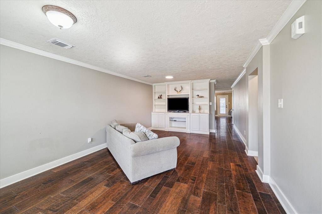 This flexible dining area doubles as an entertainment hub with a built-in media center. Perfect for hosting family meals or cozy movie nights, this space offers the best of both worlds—function and style.
