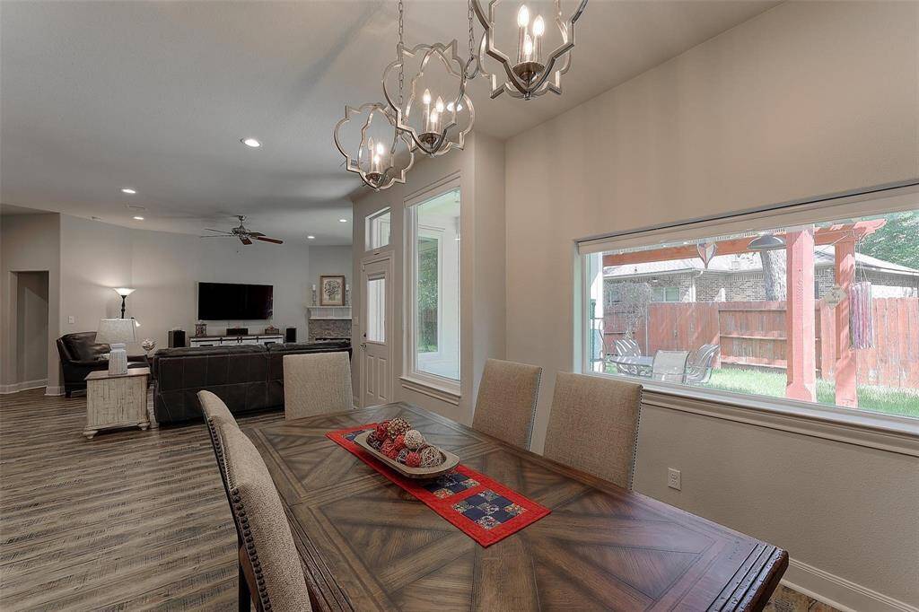 Dining room and living room are open to each other for entertaining ease.