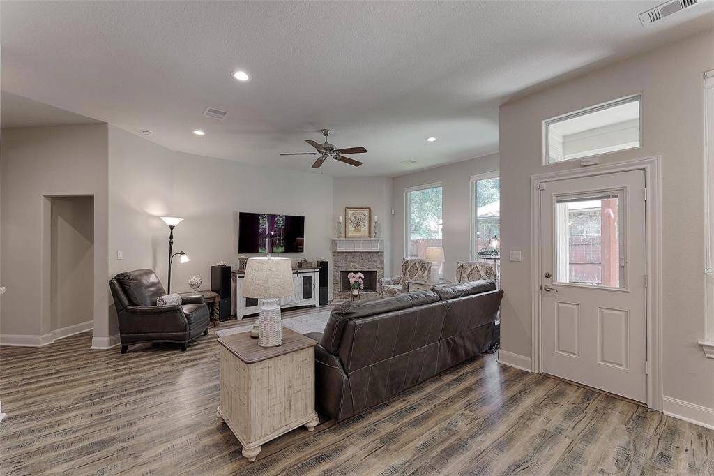 Large and bright room with cozy corner fireplace.