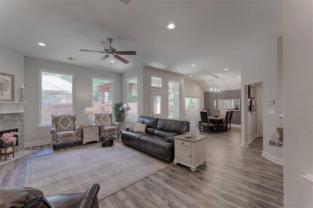 The bright living space is open and features new wood laminate flooring for a seamless design.