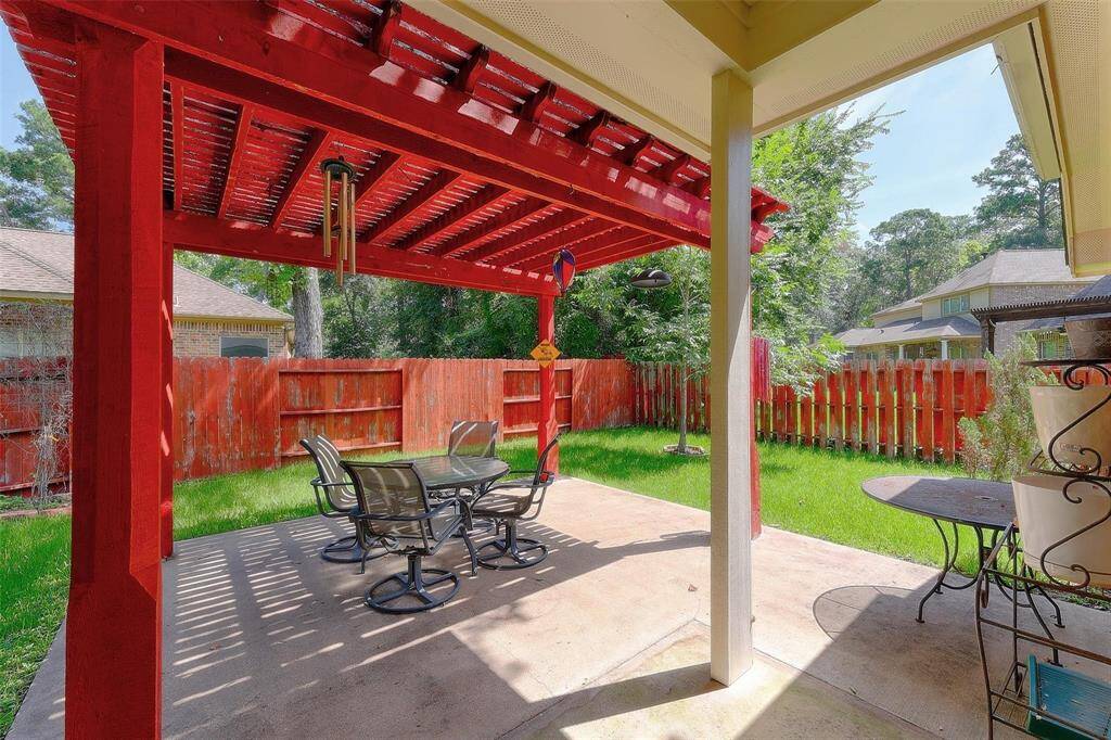 Covered back porch with pergola area is perfect for enjoying the outdoors.