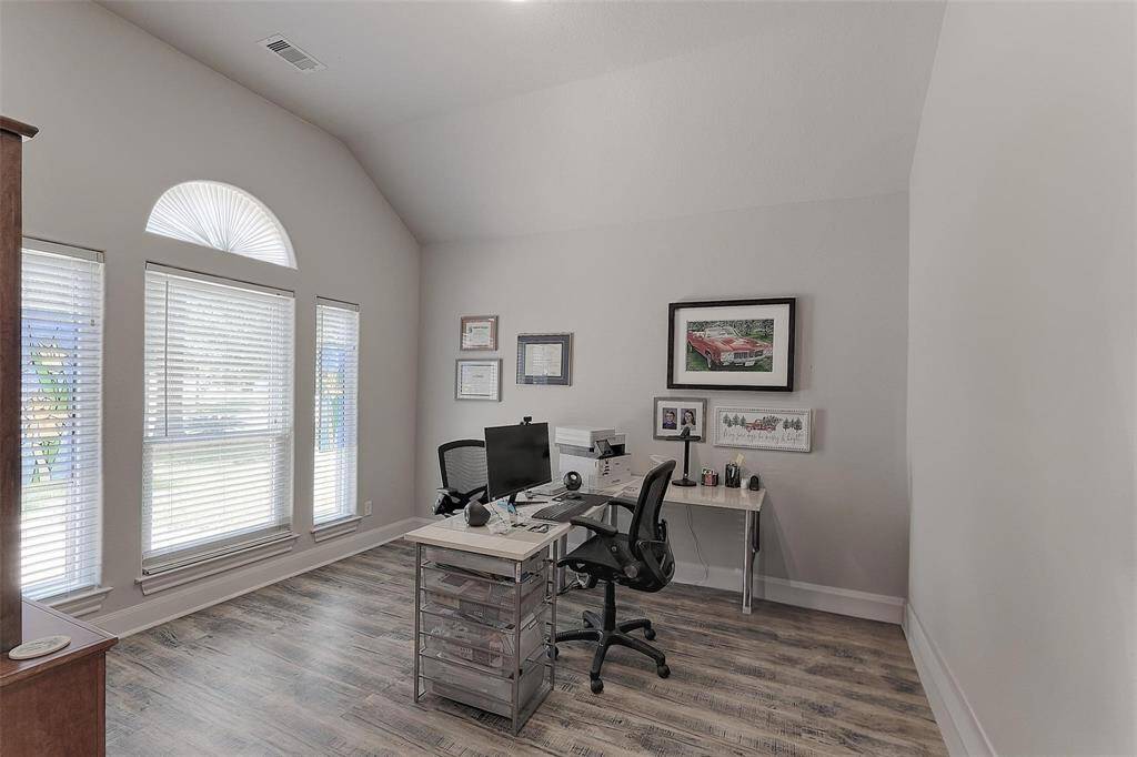 Large home office off of the entry is bright and airy with large windows overlooking the front yard. This space is currently used as a home office but could be an exercise room, play room, hobby space or second living room.
