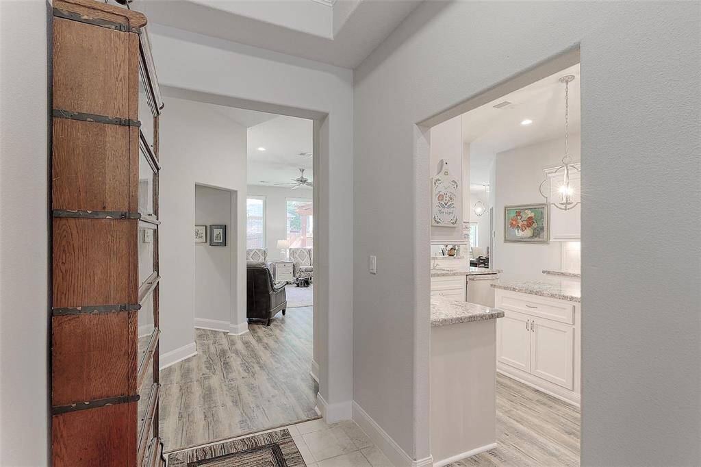 From the entry hall, there is access to the kitchen and living room.