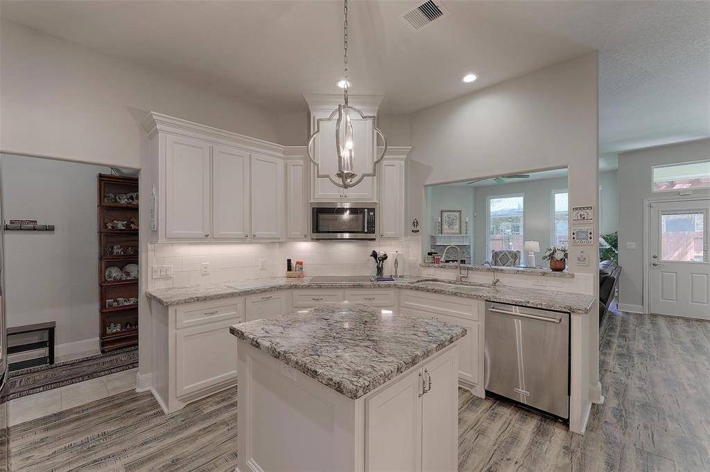 The kitchen is centrally located in the home for convenience and access from almost any room.