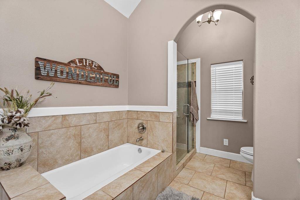 Separate tub and shower in the primary bathroom