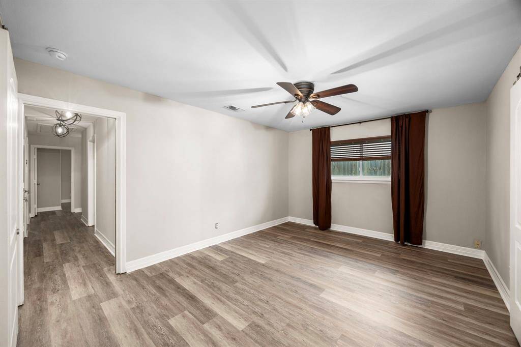 Primary bedroom with pocket door to hallway for extra privacy