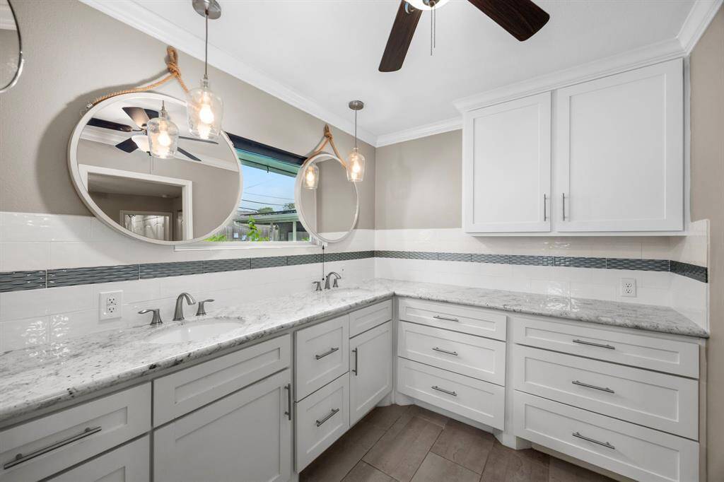 Primary bath with pool views.