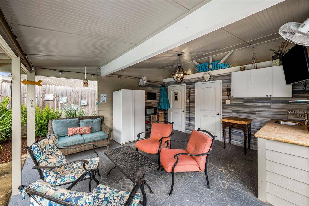 Cabana with storage closet, full bath, and a space ready for a kitchen.