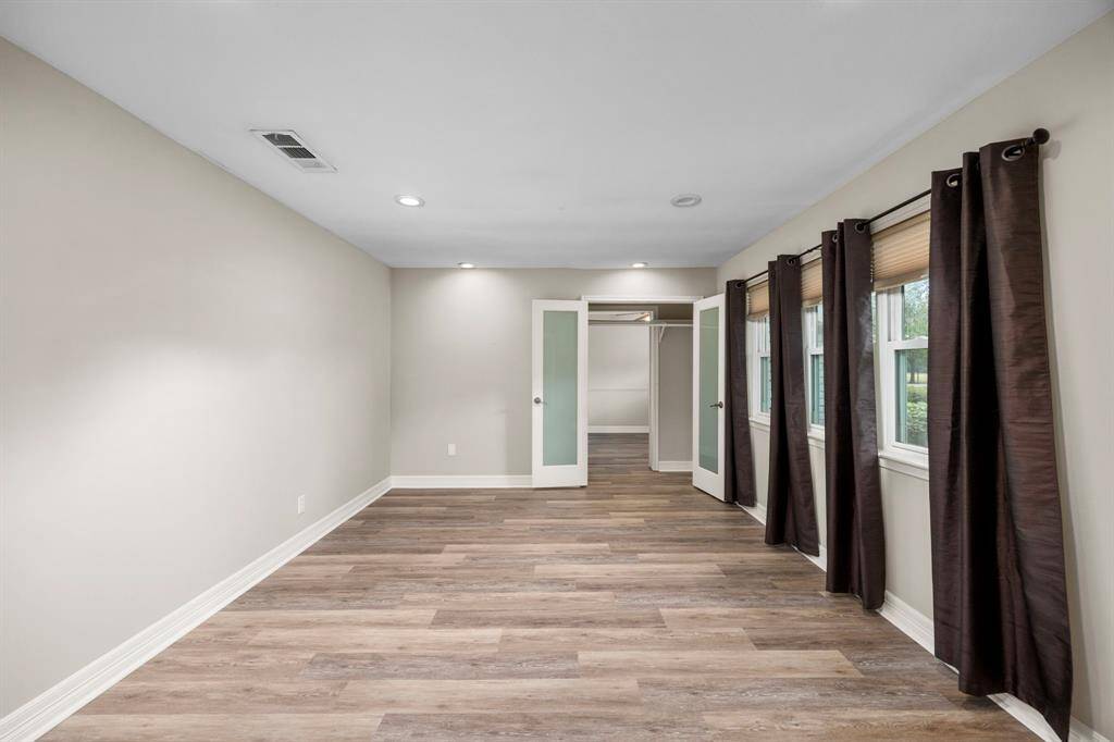 Room to the right when you walk in.  It can be an additional living space, game room, office or bedroom.