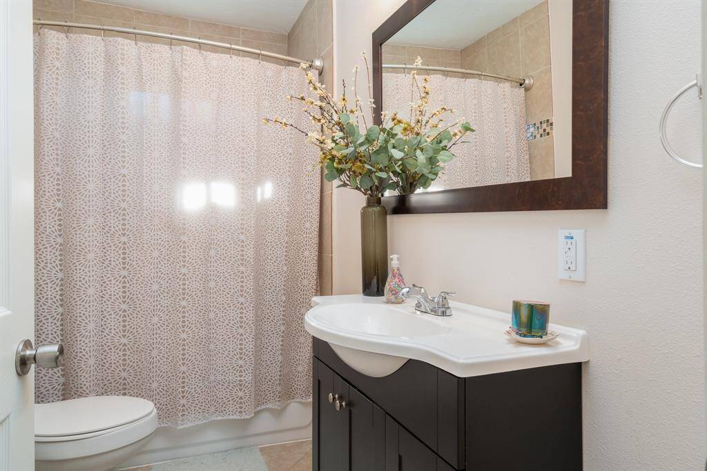 Large bathroom with extra cabinets.