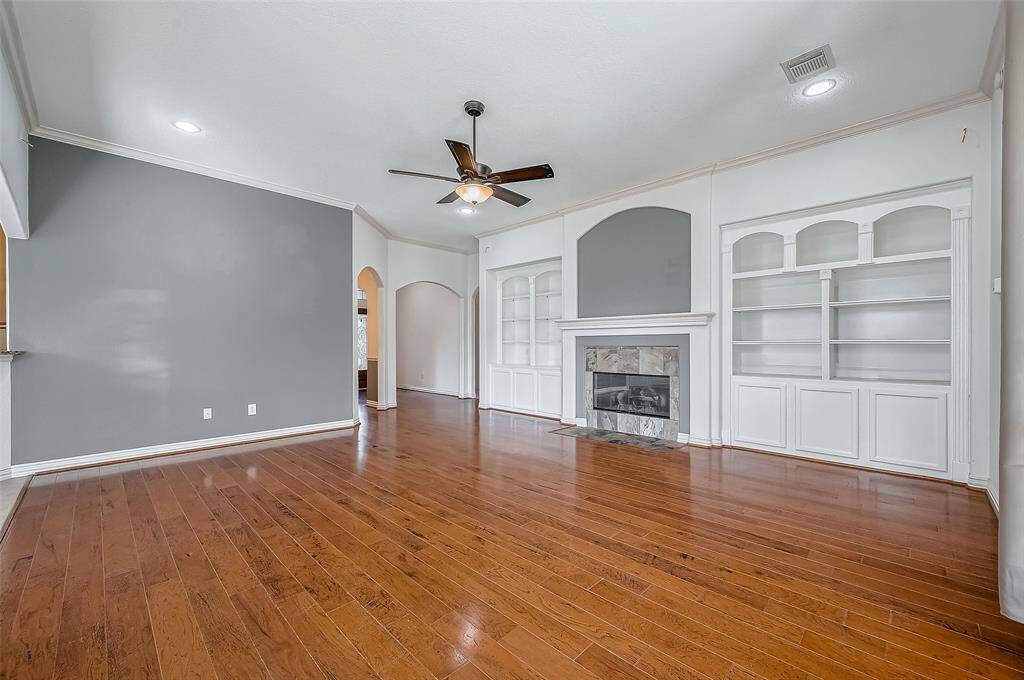 Another view of family and beautiful built ins. You will not find a better space to just sit and relax or entertain.