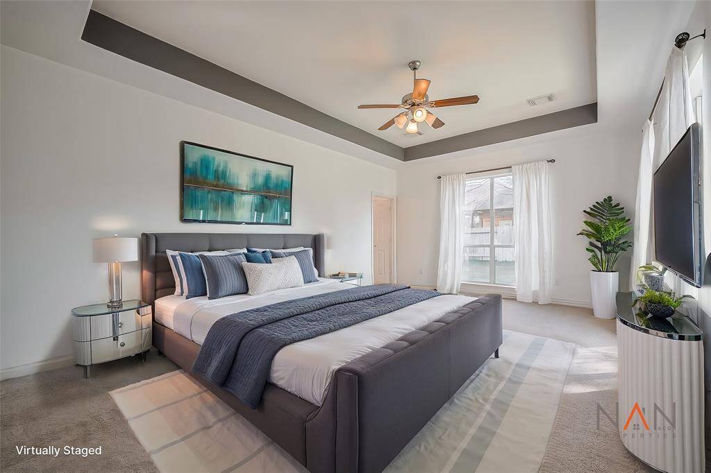This primary suite is a true oasis, offering plenty of space and beautiful natural light from its large windows. It’s a grand and inviting retreat you’re sure to love.