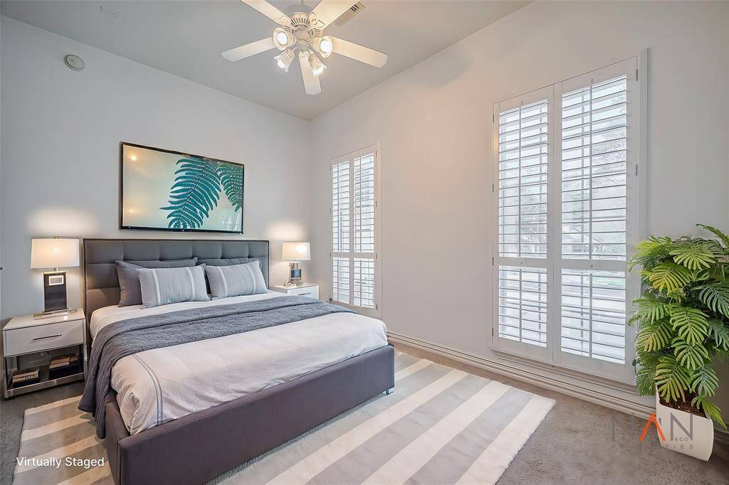 This front bedroom offer lots of natural light with beautiful shutters.