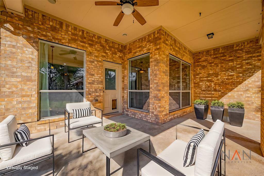 This spacious covered patio is the perfect place to relax — whether you’re curling up with a good book, sipping your morning coffee, or simply soaking in the peaceful view of the outdoors.