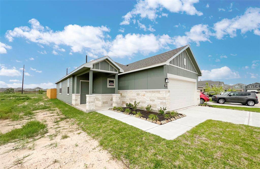 This stunning home has lovely curb appeal, a well-manicured lawn, beautiful landscaping, brick/stone elevation, covered front porch, traditional style, beautiful outdoor lantern and a double wide driveway!
