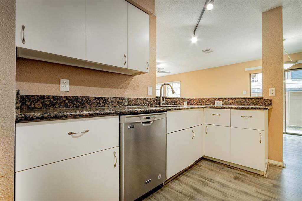 Kitchen with plenty of cabinets as work space, and great stainless steal dishwasher