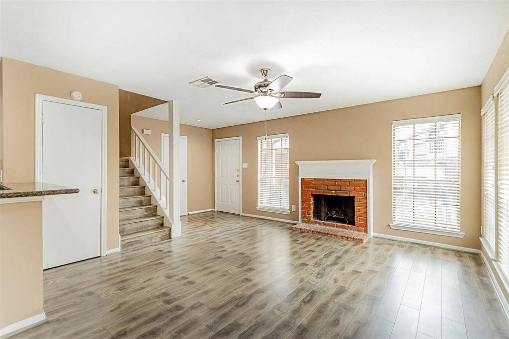 Open view with the Door, Fireplace, open to the Kitchen