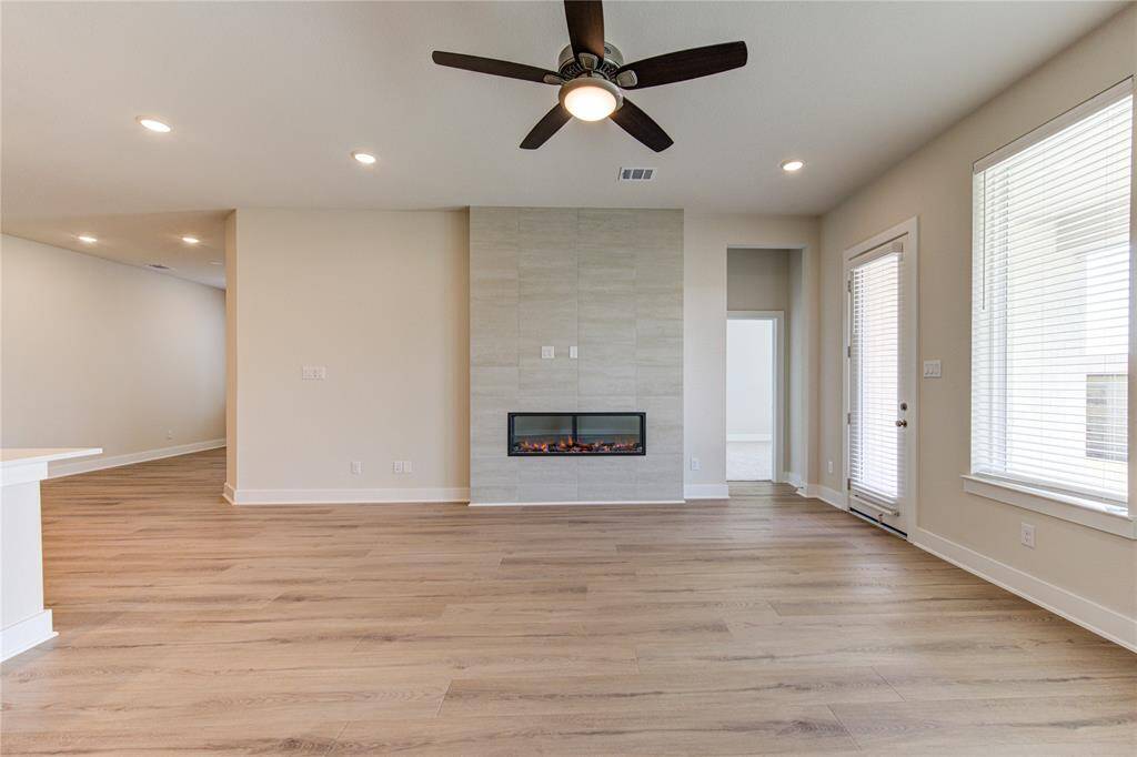 Living room and tucked off to the right is the primary suite.