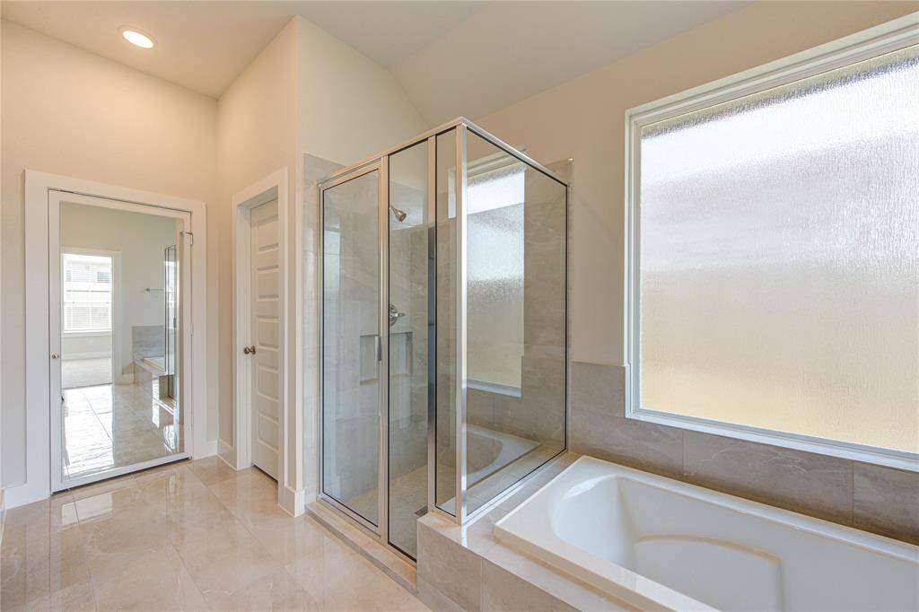 Full length mirror and linen closet. Toilet is privately enclosed.