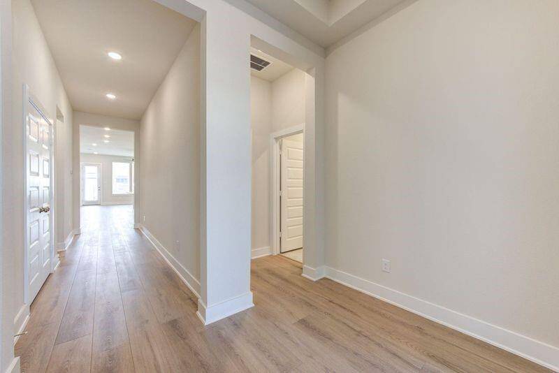 Gallery style entry with light and airy feel.