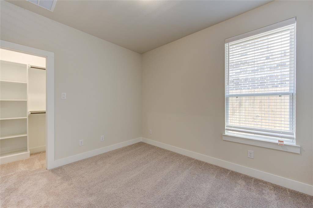 Secondary bedroom 3 with walk-in closet.
