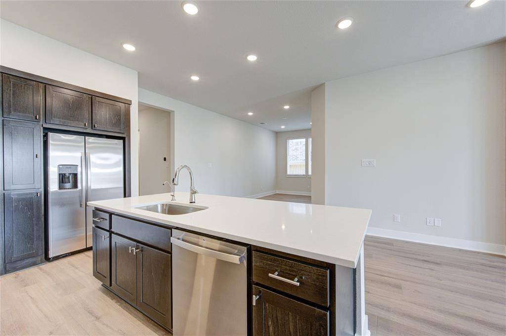 Kitchen is open to living room and dining room.